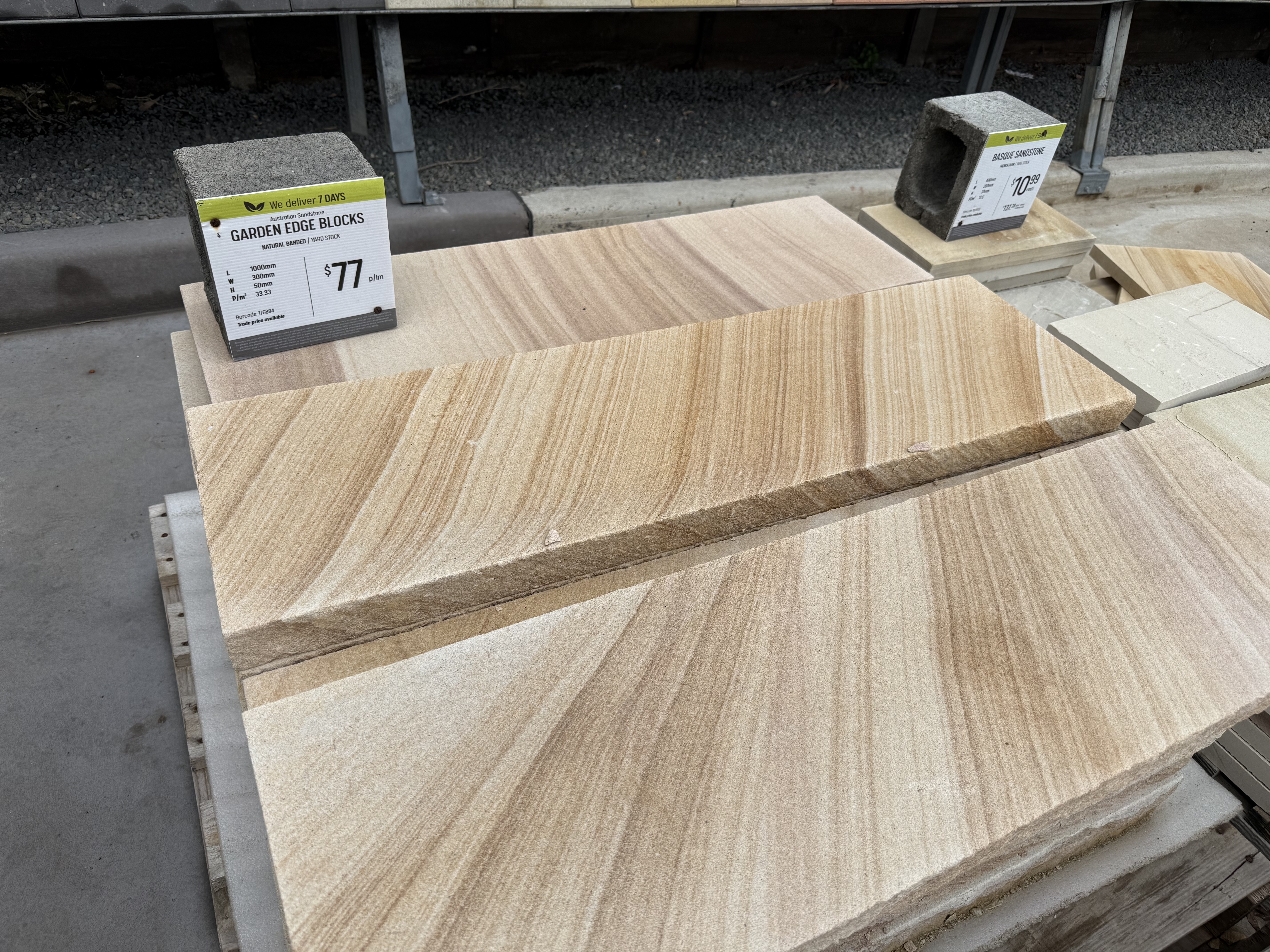 Sandstone slabs on display at a Sydney stone supplier, showing the range of grain and colour