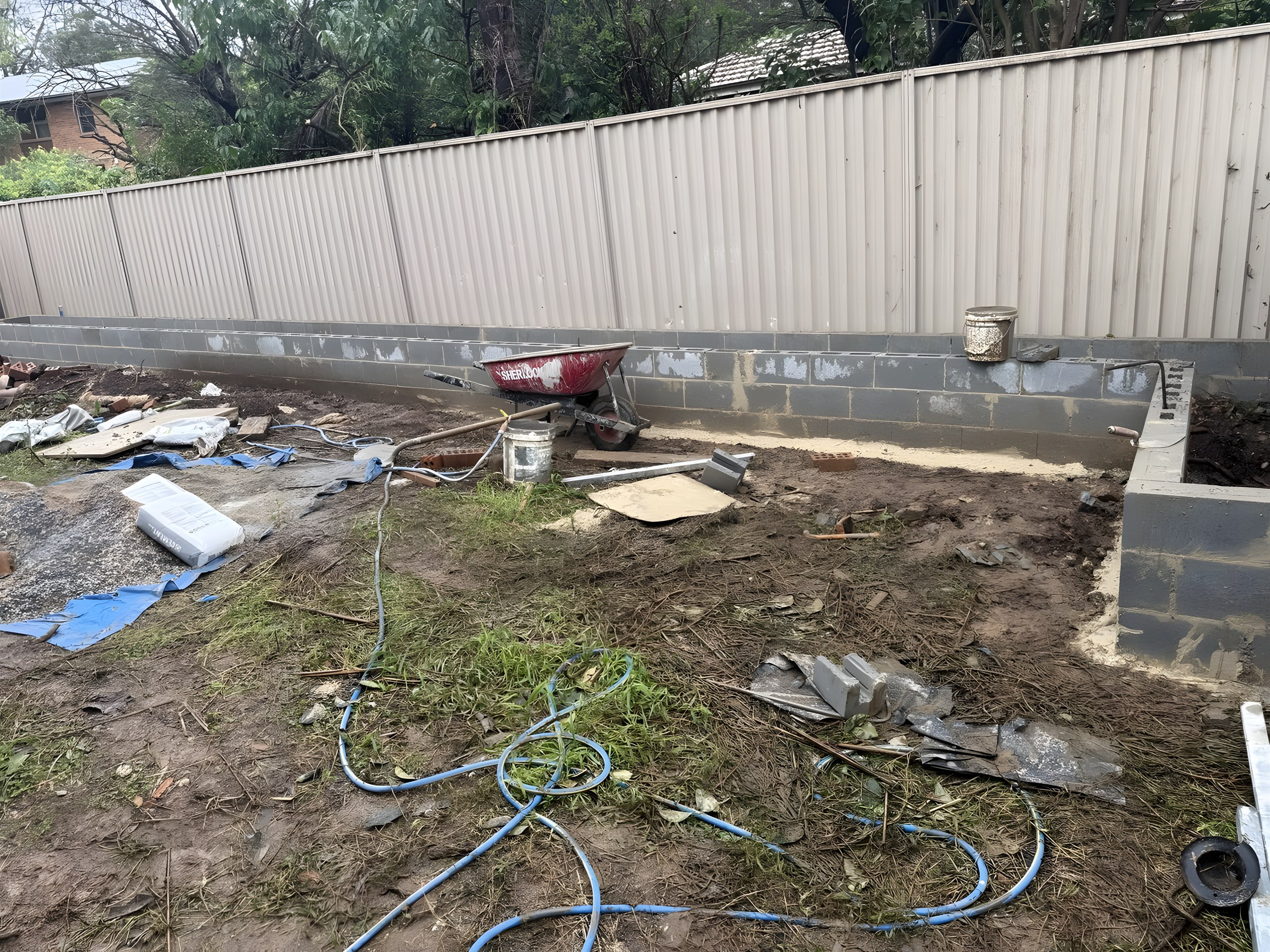 Concrete block boundary wall under construction in Hunters Hill