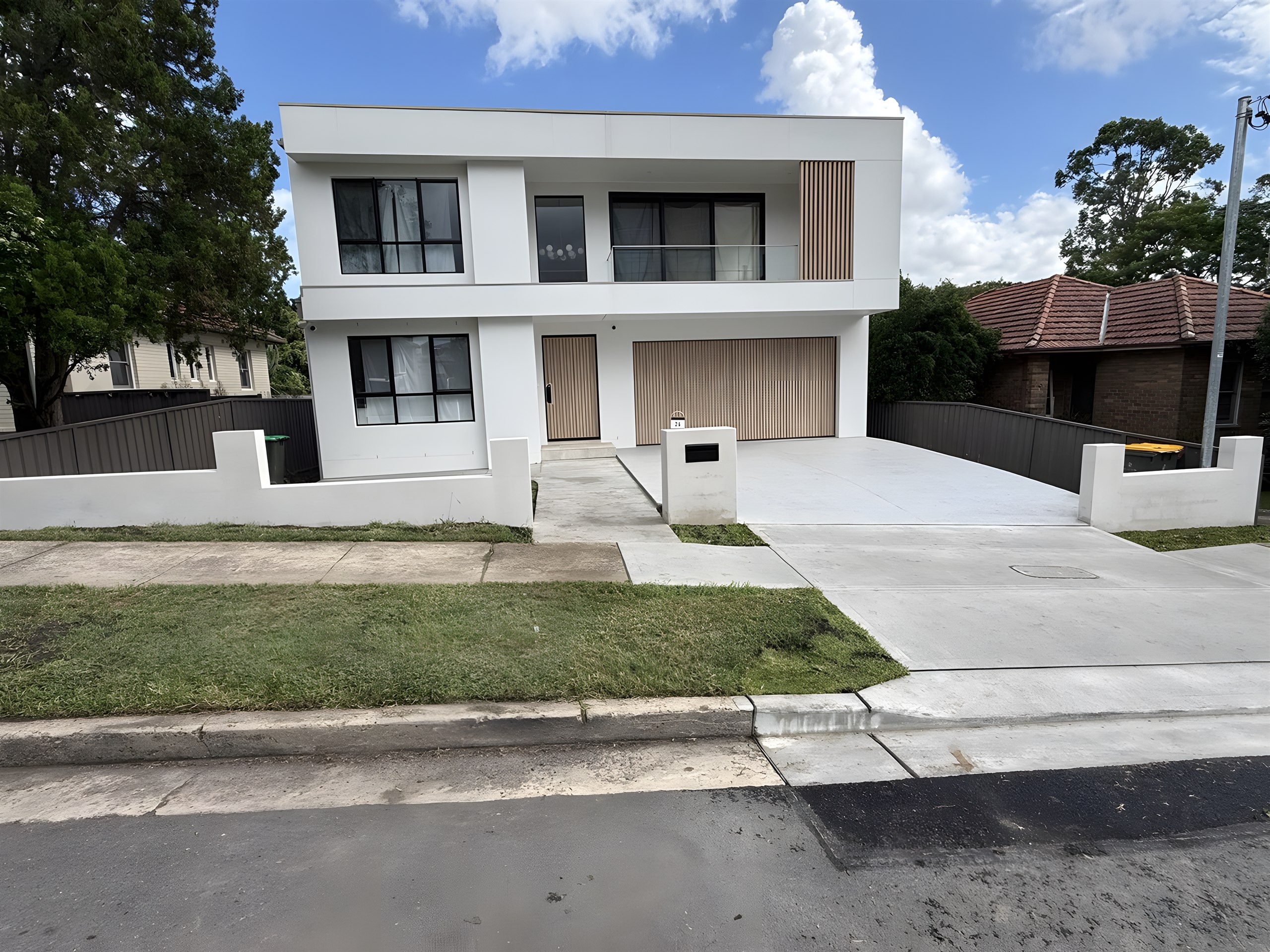 Finished turf lawn with white rendered boundary wall in Hunters Hill