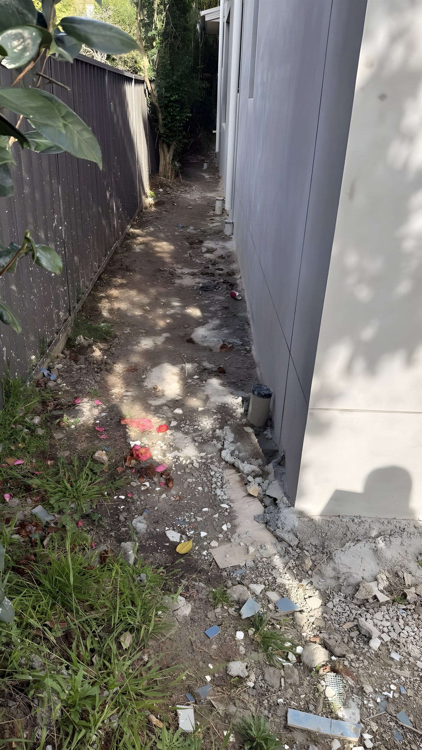 Narrow side passage of Hunters Hill house before gravel path was installed