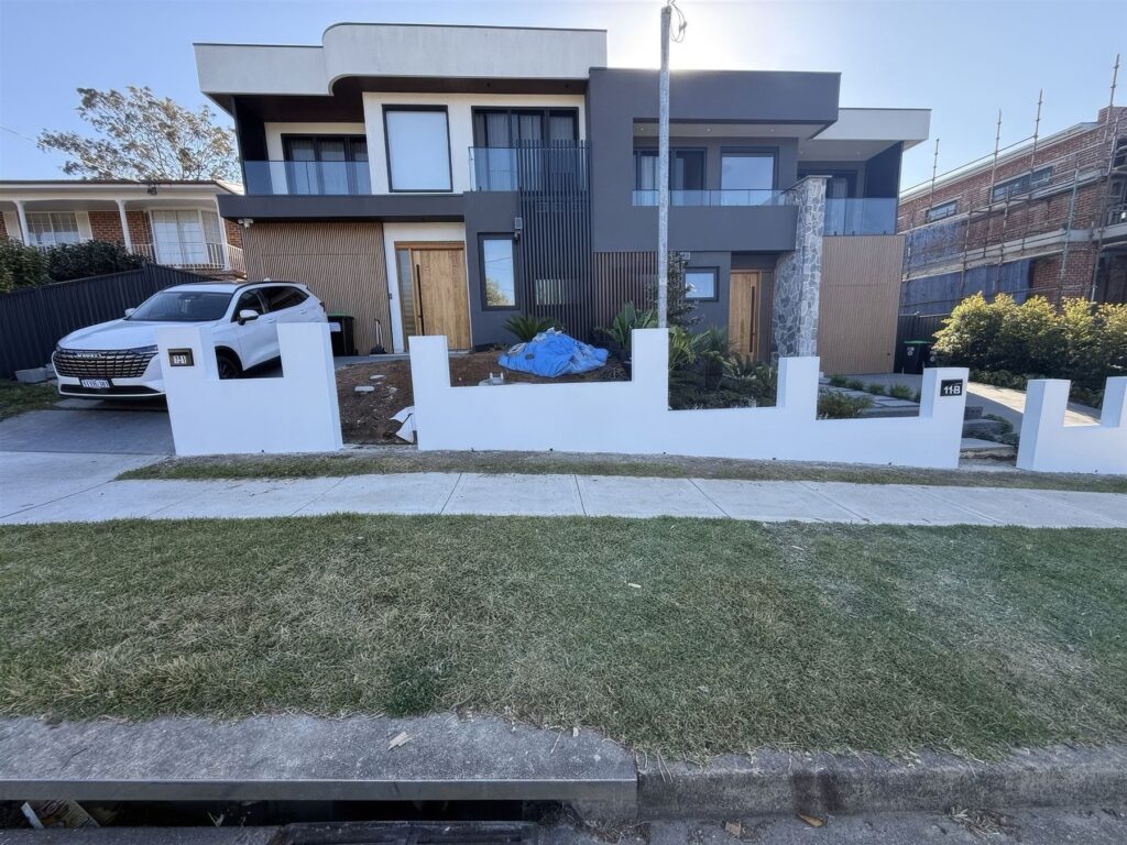 Automatic sliding gate and rendered front wall on a new duplex, Carlingford