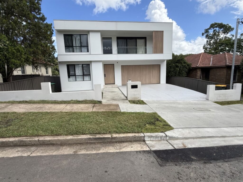 New front lawn and rendered wall on a new home
