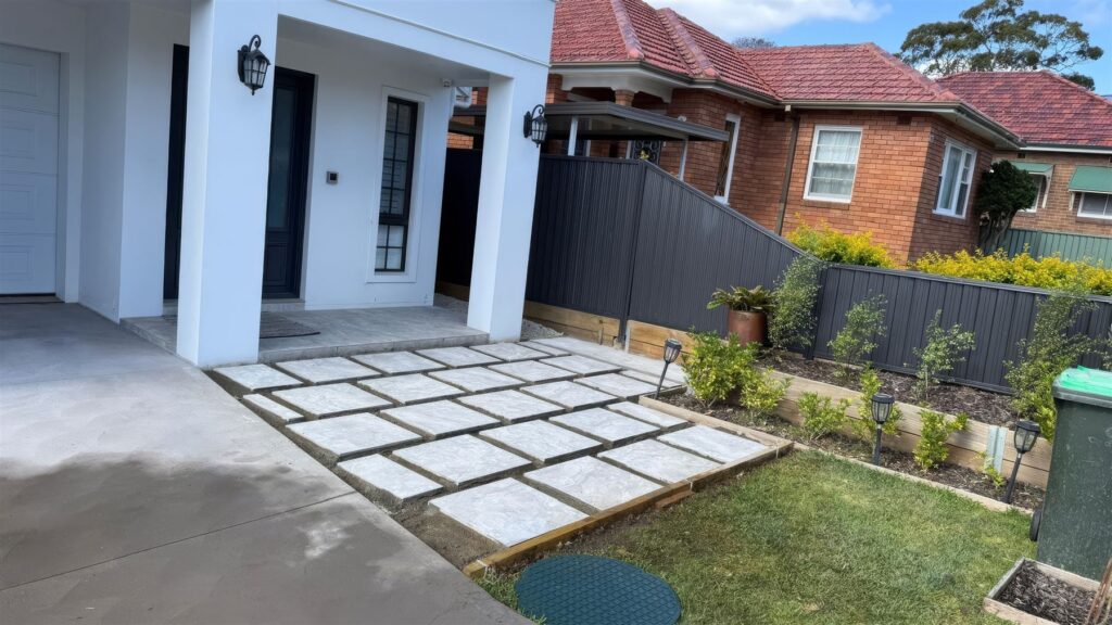 Porcelain pavers, turf and garden beds