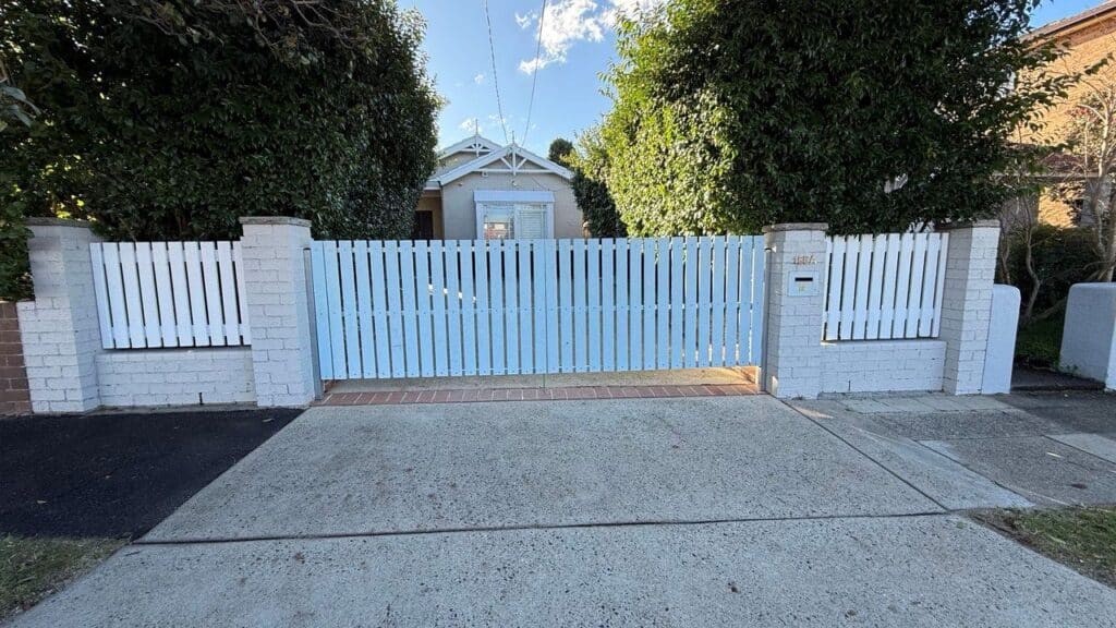White slat automatic driveway gate